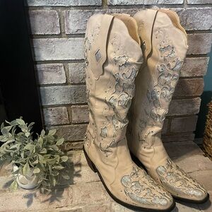 Cowgirl boots!! Sparklingly 
tan and silver. Detailed bling bling!